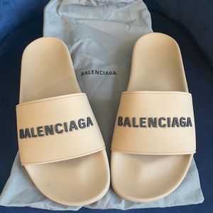 Balenciaga pool slides.